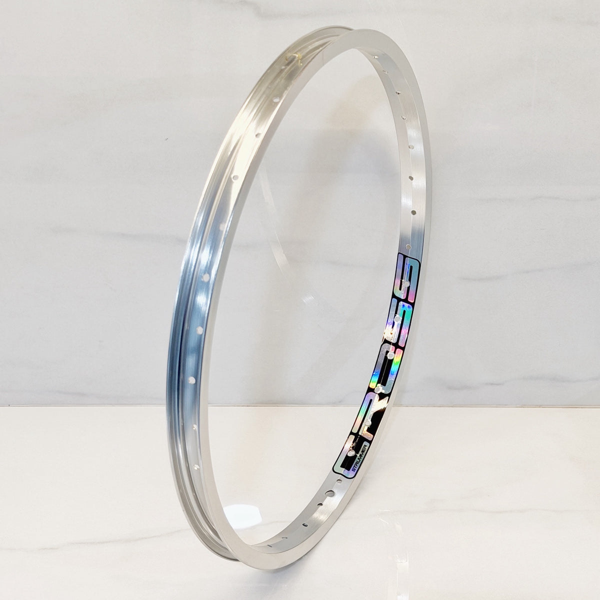 Rim Strummer Cross 20 Anodize Silver dengan decal Oil Slick