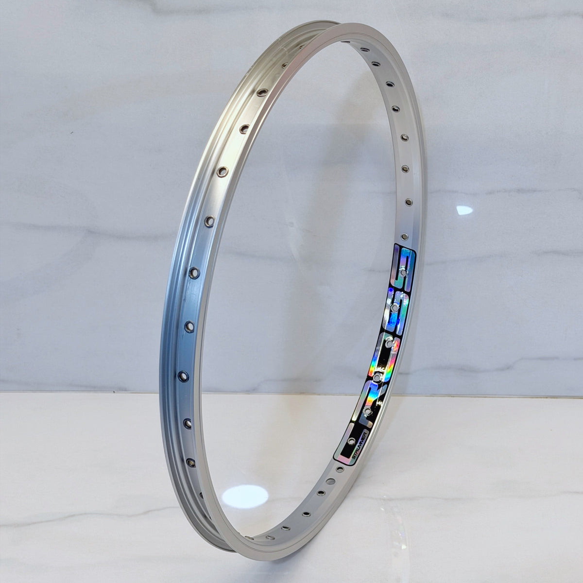 Rim Strummer Cross 20 inch Eyelet Anodize Silver, decal Oil Slick